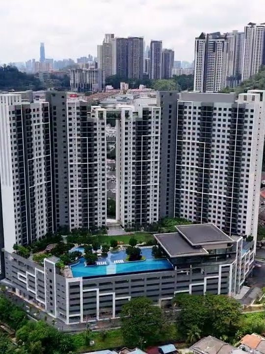 M Adora — two 31-storey towers above Wangsa Melawati, with the Kuala Lumpur skyline beyond