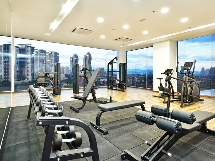 Rica Residence gymnasium overlooking the Kuala Lumpur skyline
