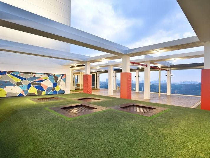 Rica Residence rooftop sky deck with trampoline park and climbing wall